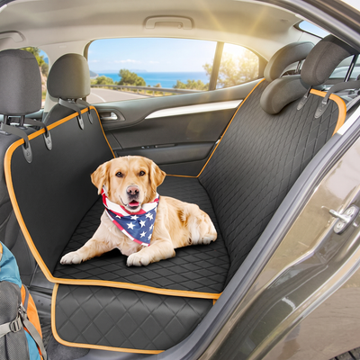 Dog sitting on waterproof hammock car seat cover